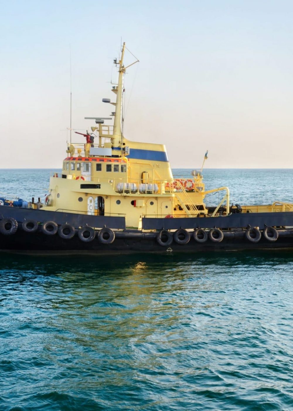 Yellow towboat in a harbor